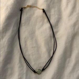 Cord necklace with white faceted pendant